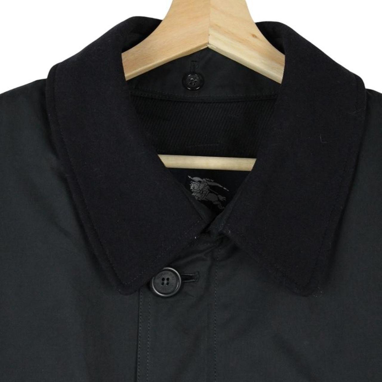 Burberry navy blue wool coat with Nova Check lining and logo detail.