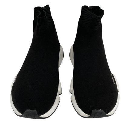 Balenciaga Speed 2 black and white trainers with logo detailing and cotton material.