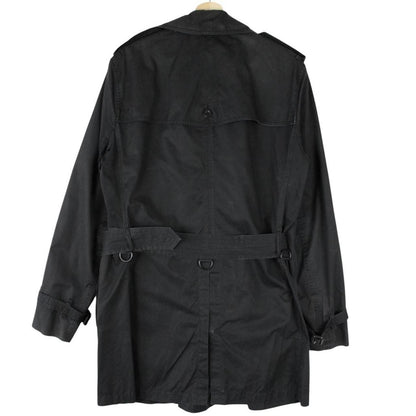 Burberry black trench coat featuring Nova Check pattern, double-breasted design, and belted waist.