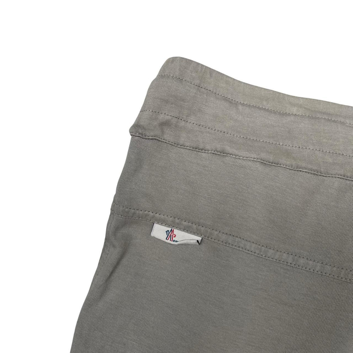 Moncler grey jogger shorts cotton material with logo detail and minor marks.