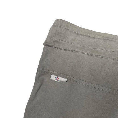 Moncler grey jogger shorts cotton material with logo detail and minor marks.
