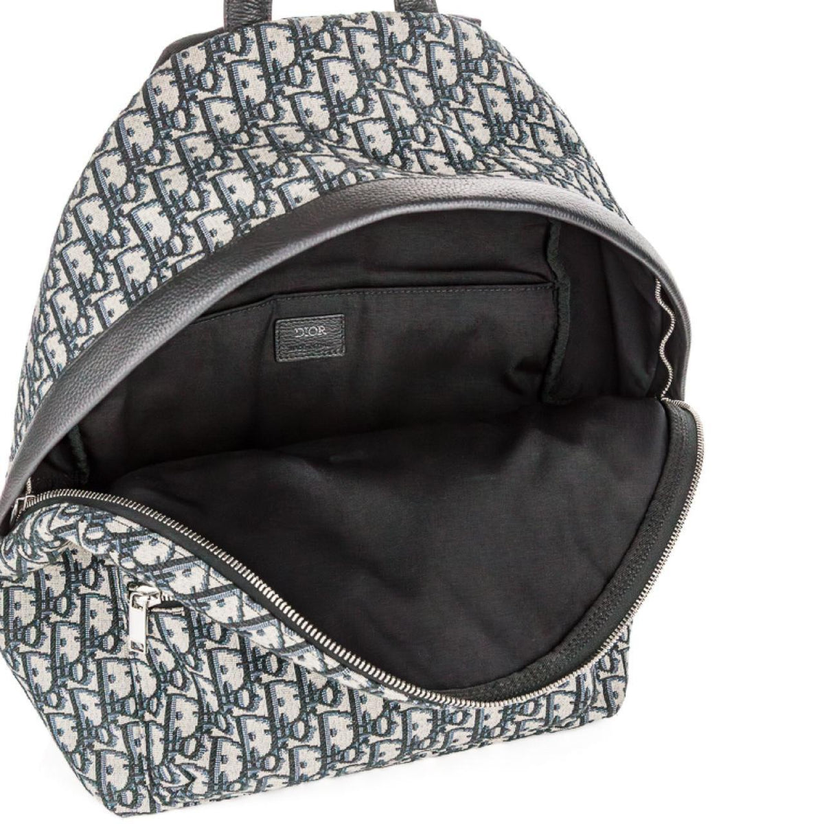 Dior beige and black oblique jacquard monogram rider backpack with logo pattern.