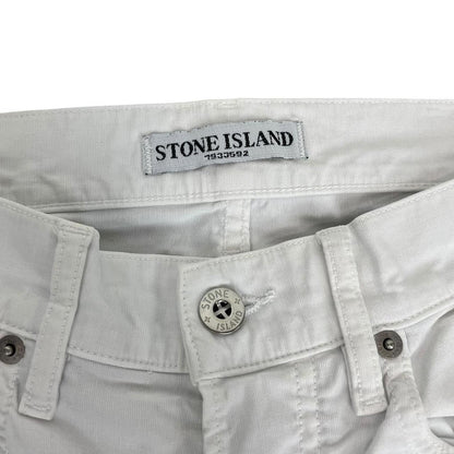 Stone Island white slim fit cotton trousers with logo patch and front mark.