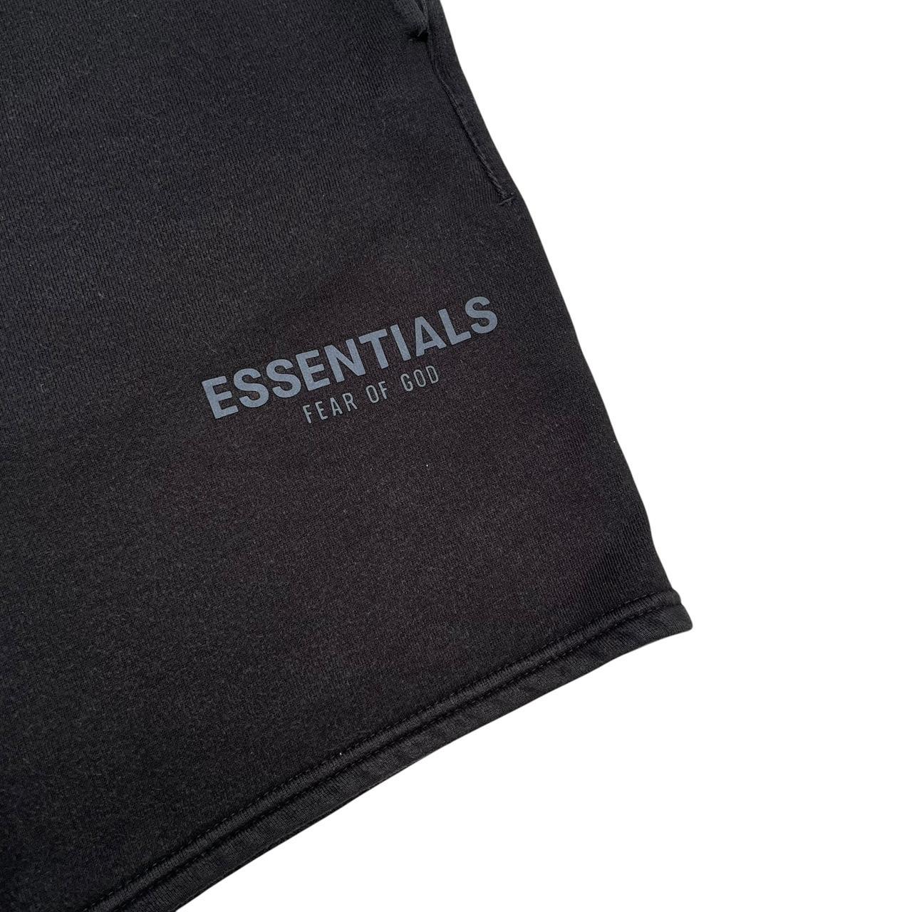 Essentials black jogger shorts cotton material with faded detailing and logo.