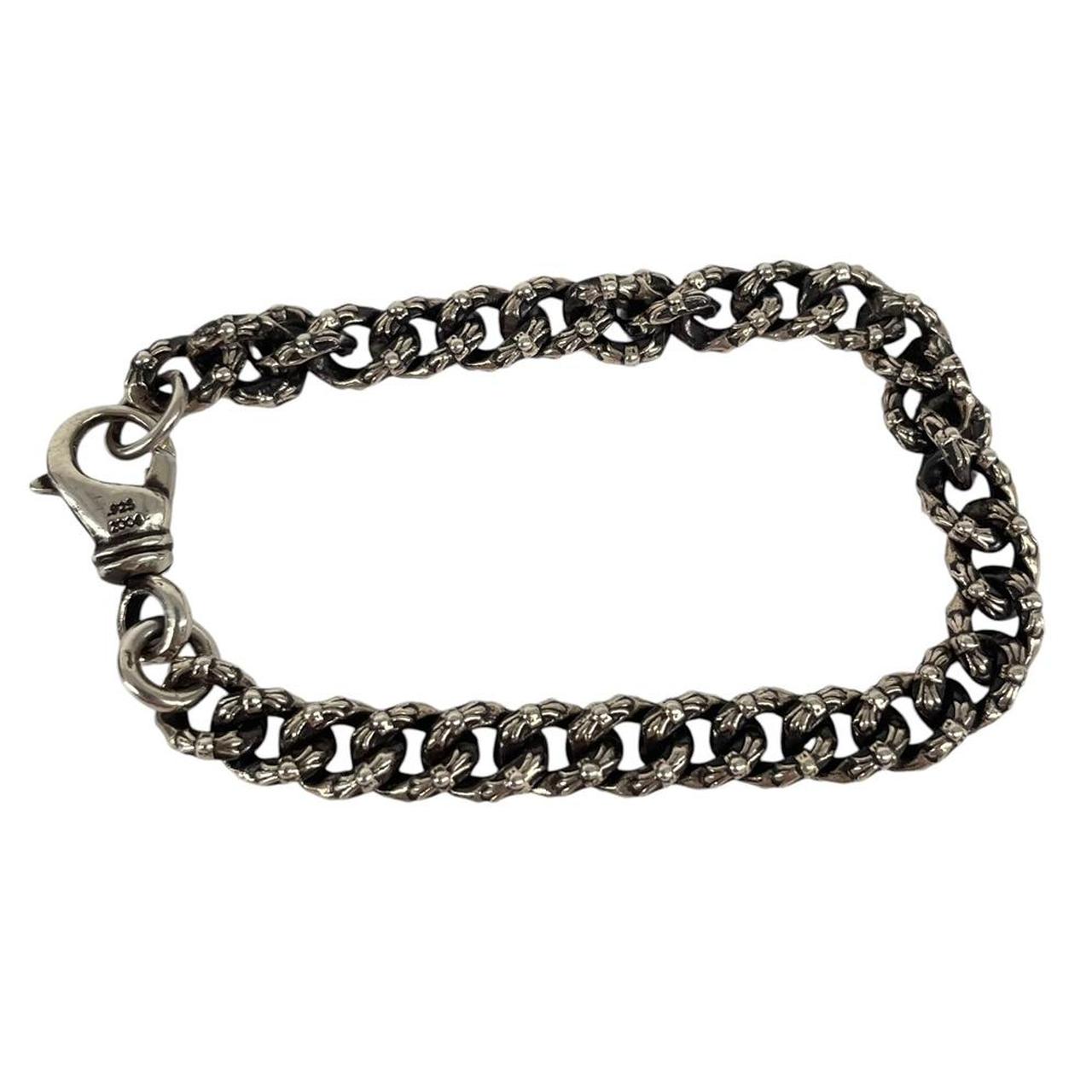 Chrome Hearts silver bracelet with intricate link design and logo detailing.