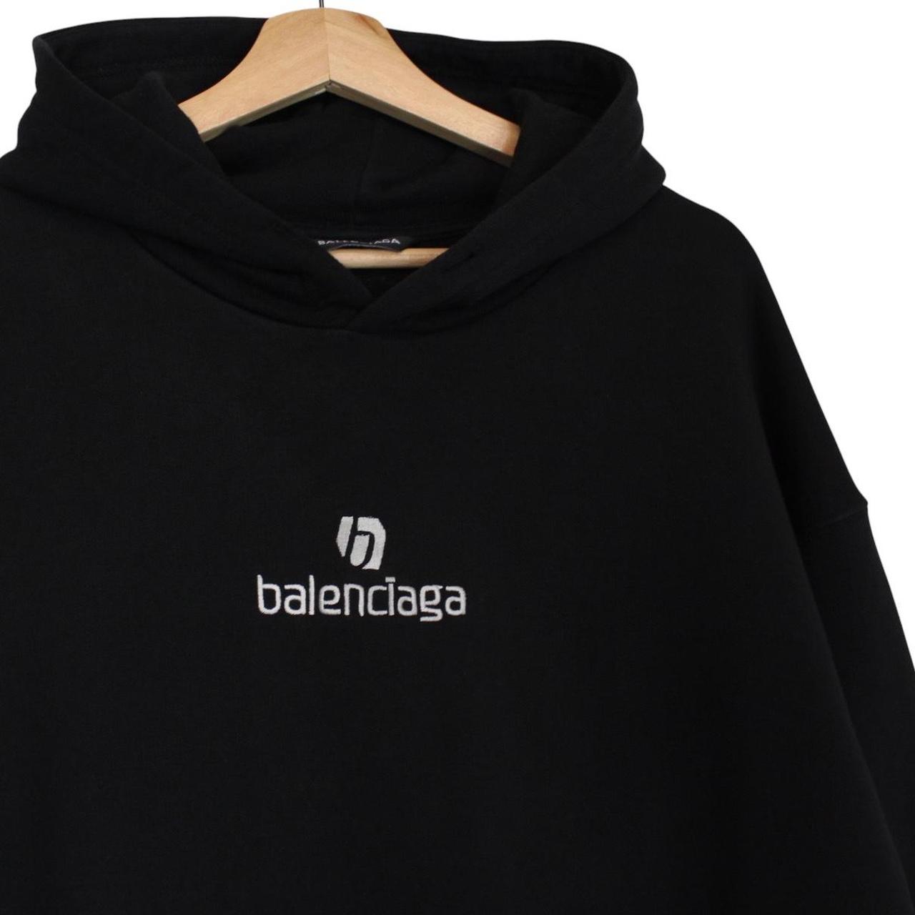 Balenciaga black and white cotton hoodie with sponsor logo and large fit.