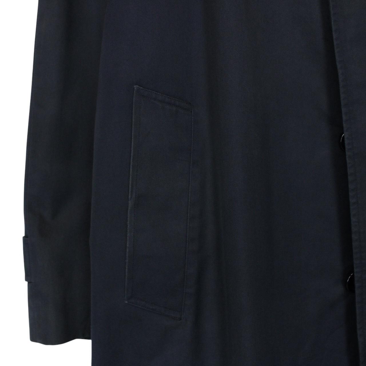 Burberry navy blue trench coat featuring classic Nova Check pattern and single-breasted design.