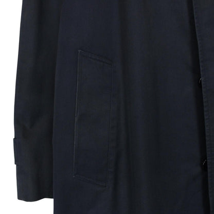 Burberry navy blue trench coat featuring classic Nova Check pattern and single-breasted design.