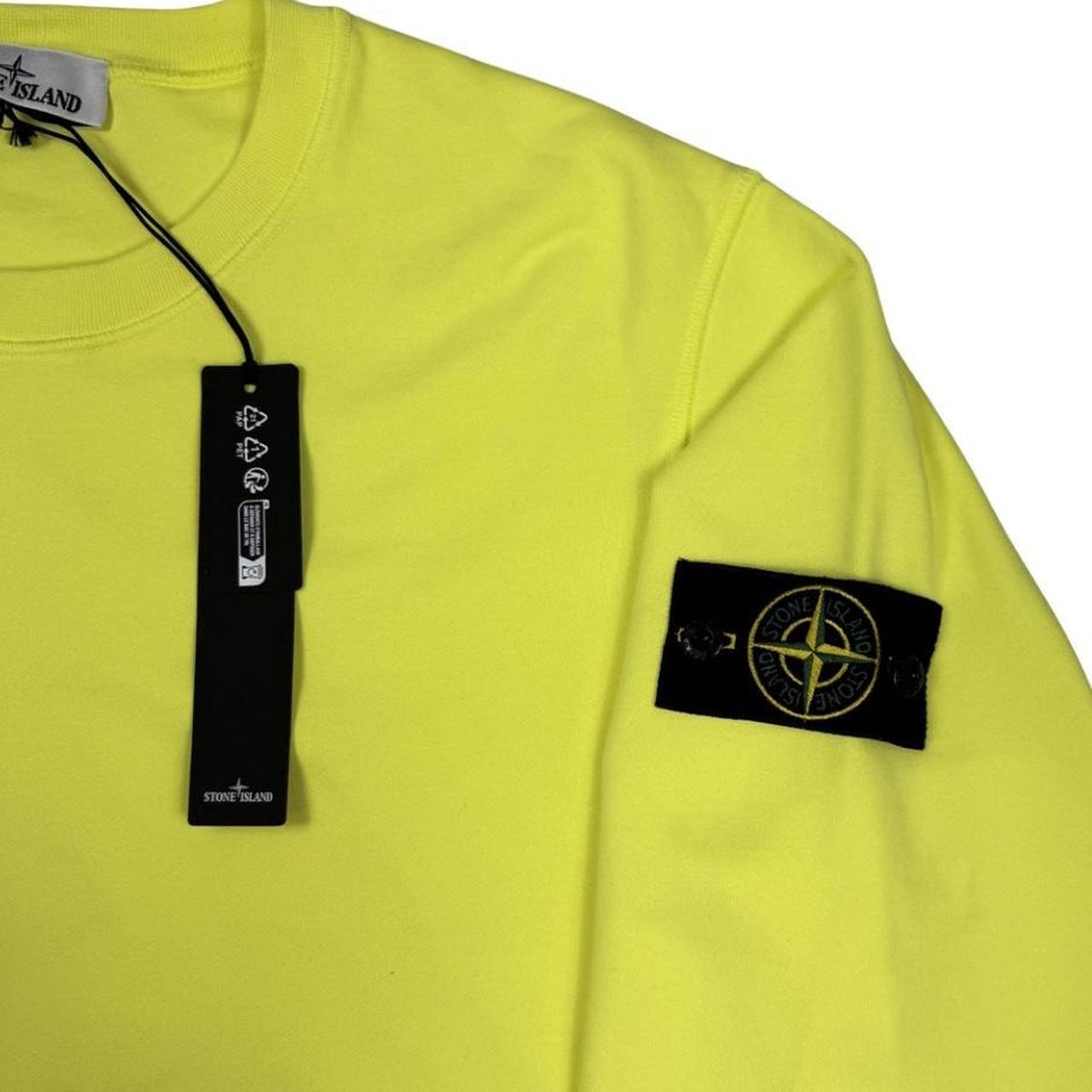 Stone Island yellow sweatshirt made from organic cotton with logo patch on sleeve.