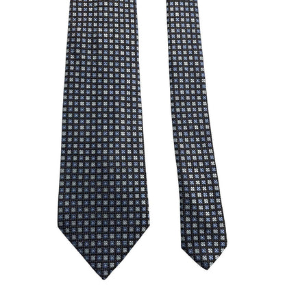 Ermenegildo Zegna blue silk tie with subtle sheen and logo detail.