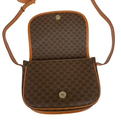 CELINE brown and tan duffel bag with Macadam pattern and leather/canvas material.