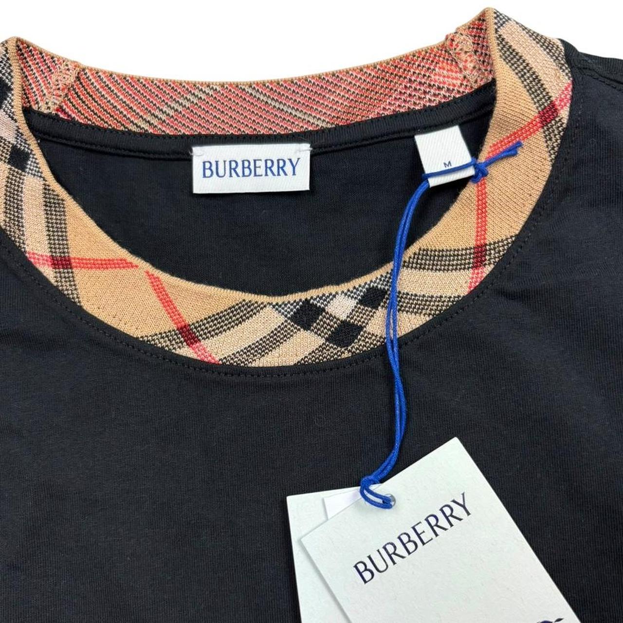 Burberry black pocket t-shirt with Nova Check collar and logo detail.