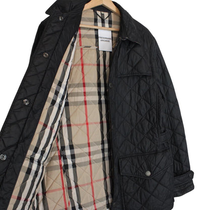 Burberry black quilted field jacket with Nova Check lining and diamond pattern.