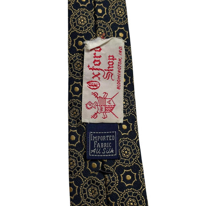 Polo Ralph Lauren black and gold silk tie with geometric print design.