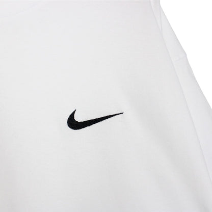 Nike white short sleeve cotton t-shirt with pocket and vintage logo detail.