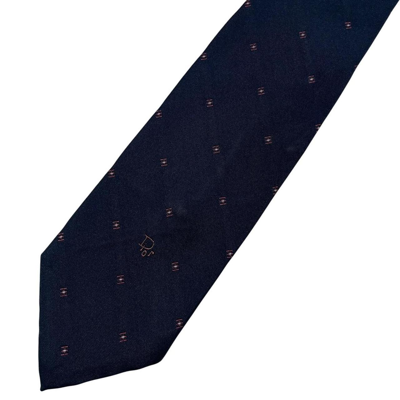 Christian Dior navy blue tie with silk blend, featuring subtle sheen and classic design.