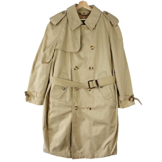 Burberry beige trench coat with Nova Check pattern, double breasted and belted design.