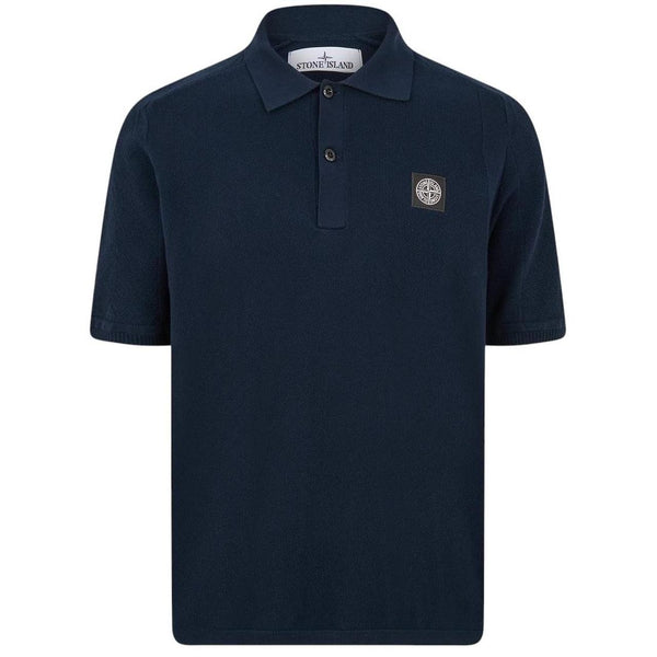 Stone Island navy blue polo shirt with Compass patch and three-button placket.