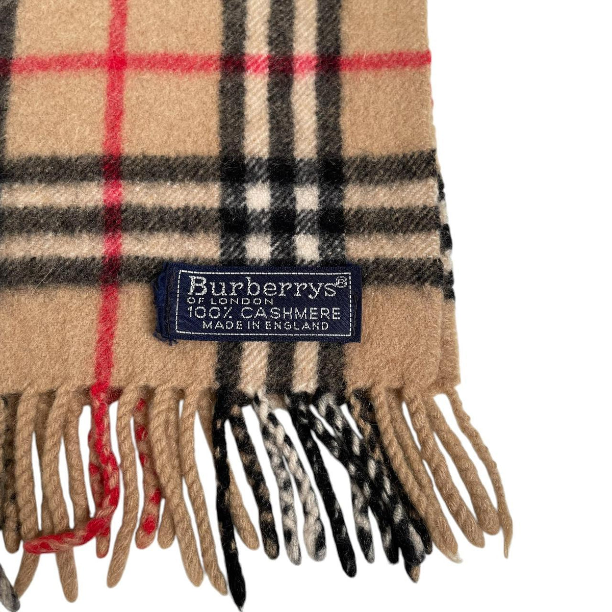 Burberry beige cashmere scarf featuring classic Nova Check pattern and logo detail.