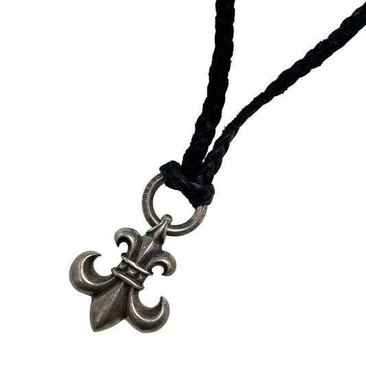 Chrome Hearts silver fleur de lis pendant with leather cord, vintage 1998 design.