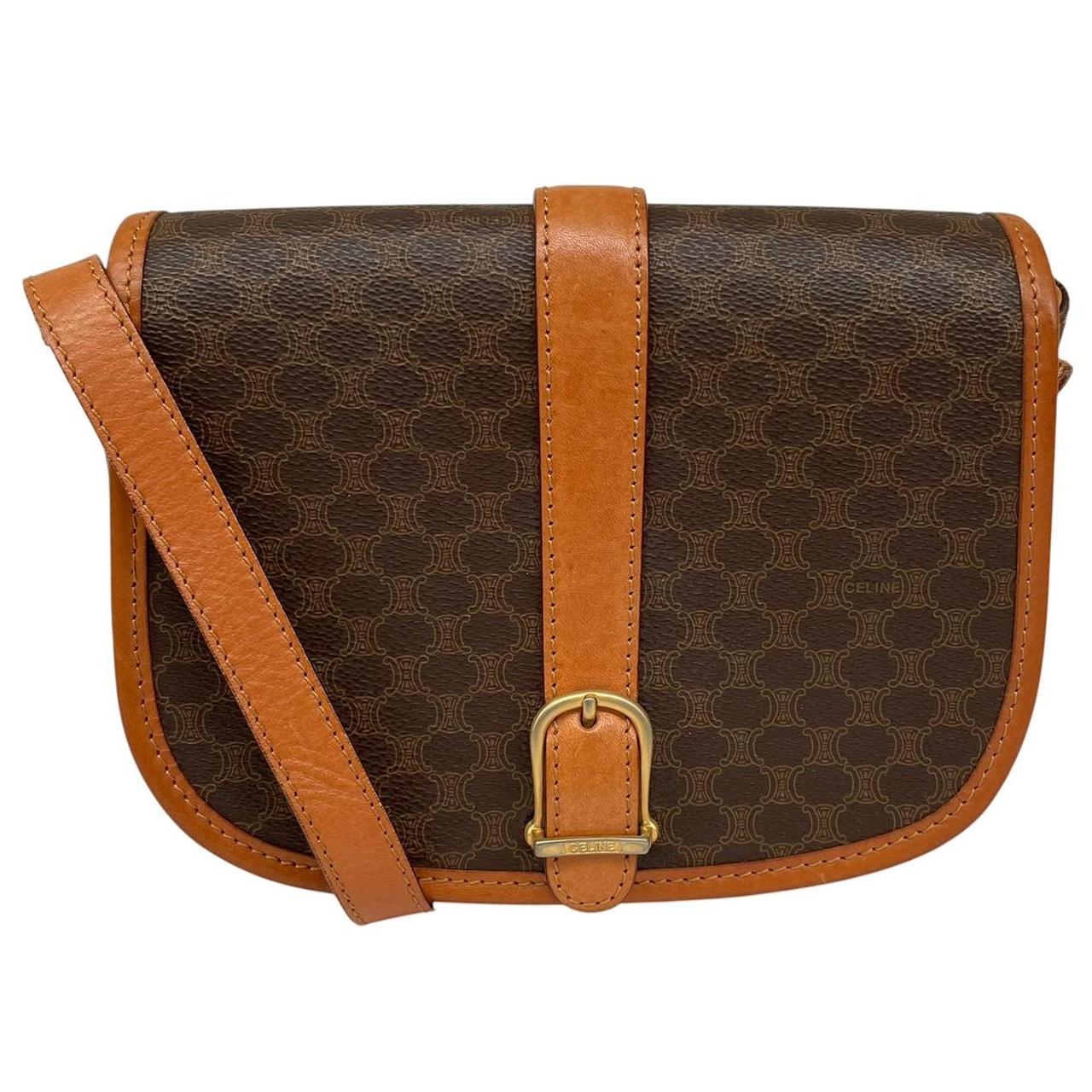 CELINE brown and tan duffel bag with Macadam pattern and leather/canvas material.