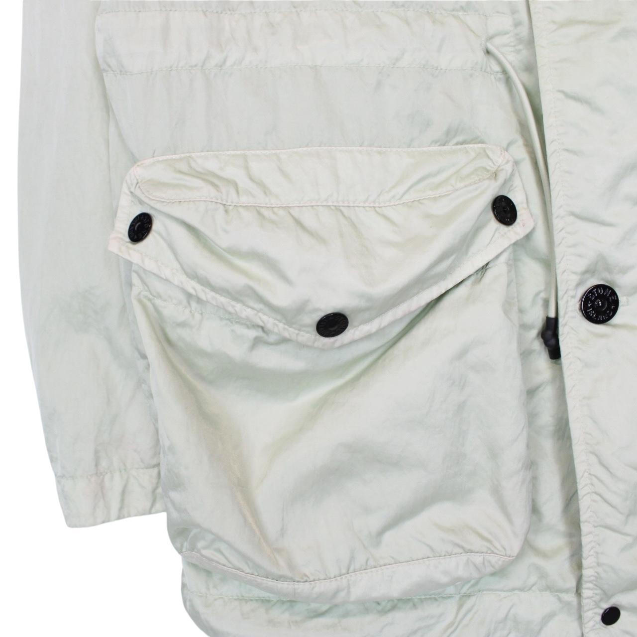 Stone Island mint green multi pocket jacket with logo patch and nylon material.