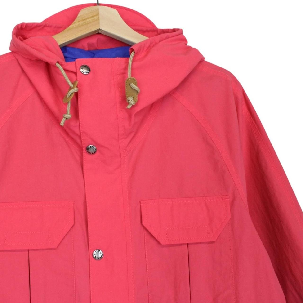 Gucci pink windbreaker jacket with North Face logo and full zip design.