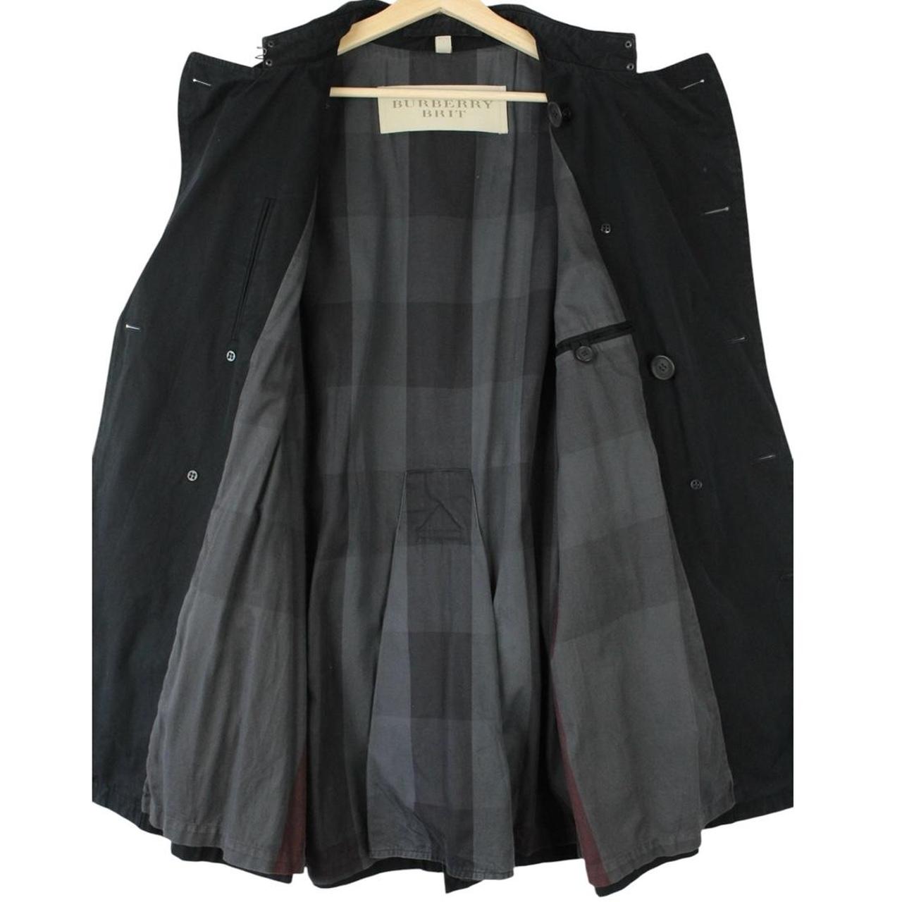 Burberry black trench coat with Nova Check pattern and double-breasted design.