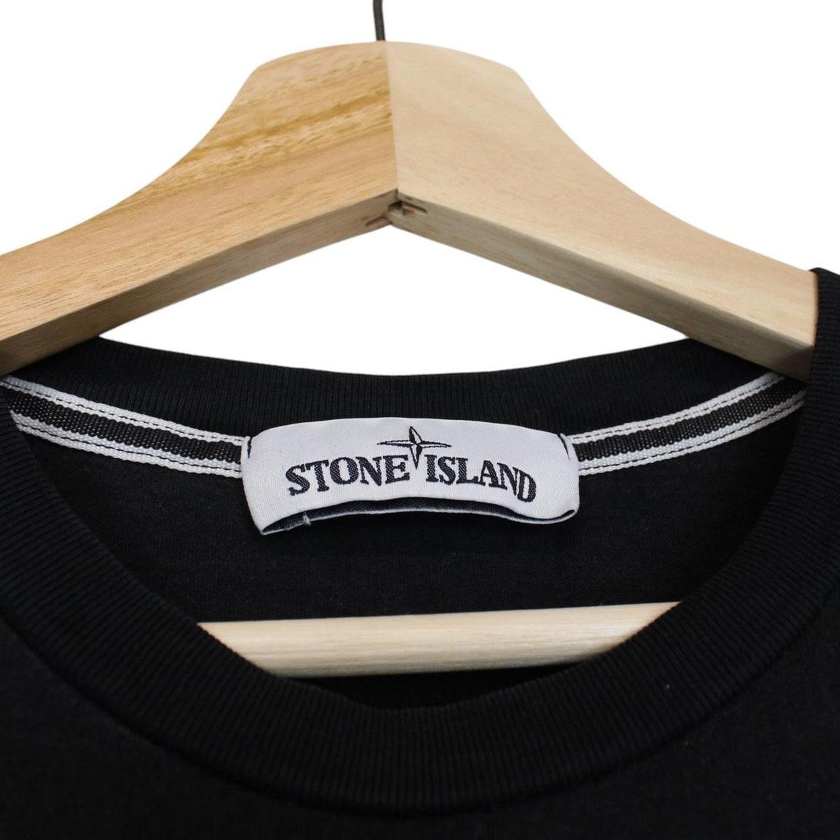 Stone Island black short sleeve t-shirt with logo print on chest and cotton material.