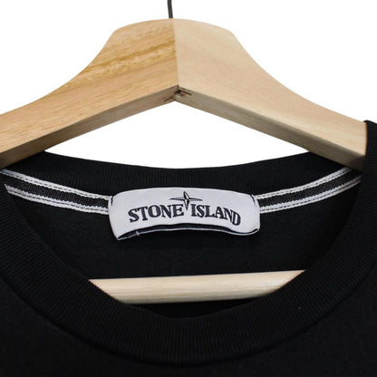 Stone Island black short sleeve t-shirt with logo print on chest and cotton material.
