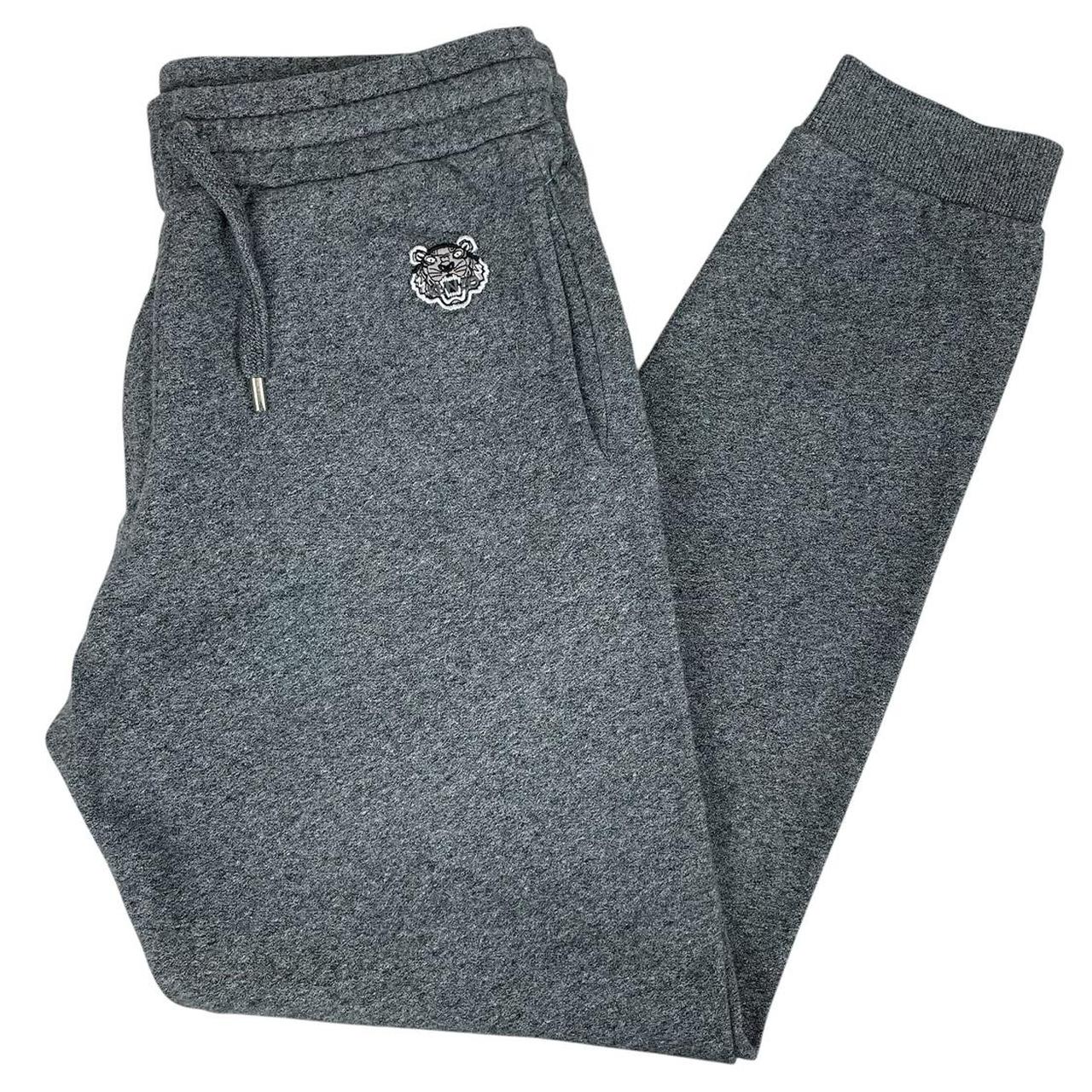Kenzo grey joggers featuring embroidered tiger logo and soft cotton material.