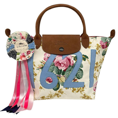Longchamp multi tote bag featuring Tracey Emin artwork and iconic foldable design.