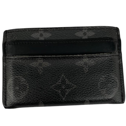 Louis Vuitton black and grey coated canvas double card holder with monogram pattern.