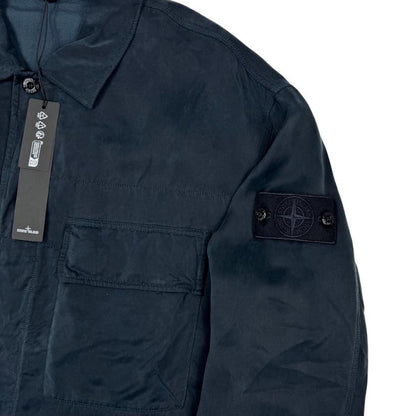 Stone Island navy blue overshirt jacket with flap pocket and monochrome logo patch.