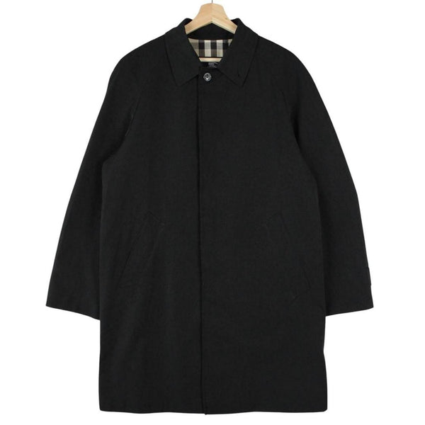 Burberry black Balmacaan coat with Nova Check lining and logo detail.