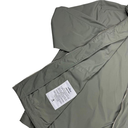 Stone Island green full zip jacket with logo patch and micro twill fabric.