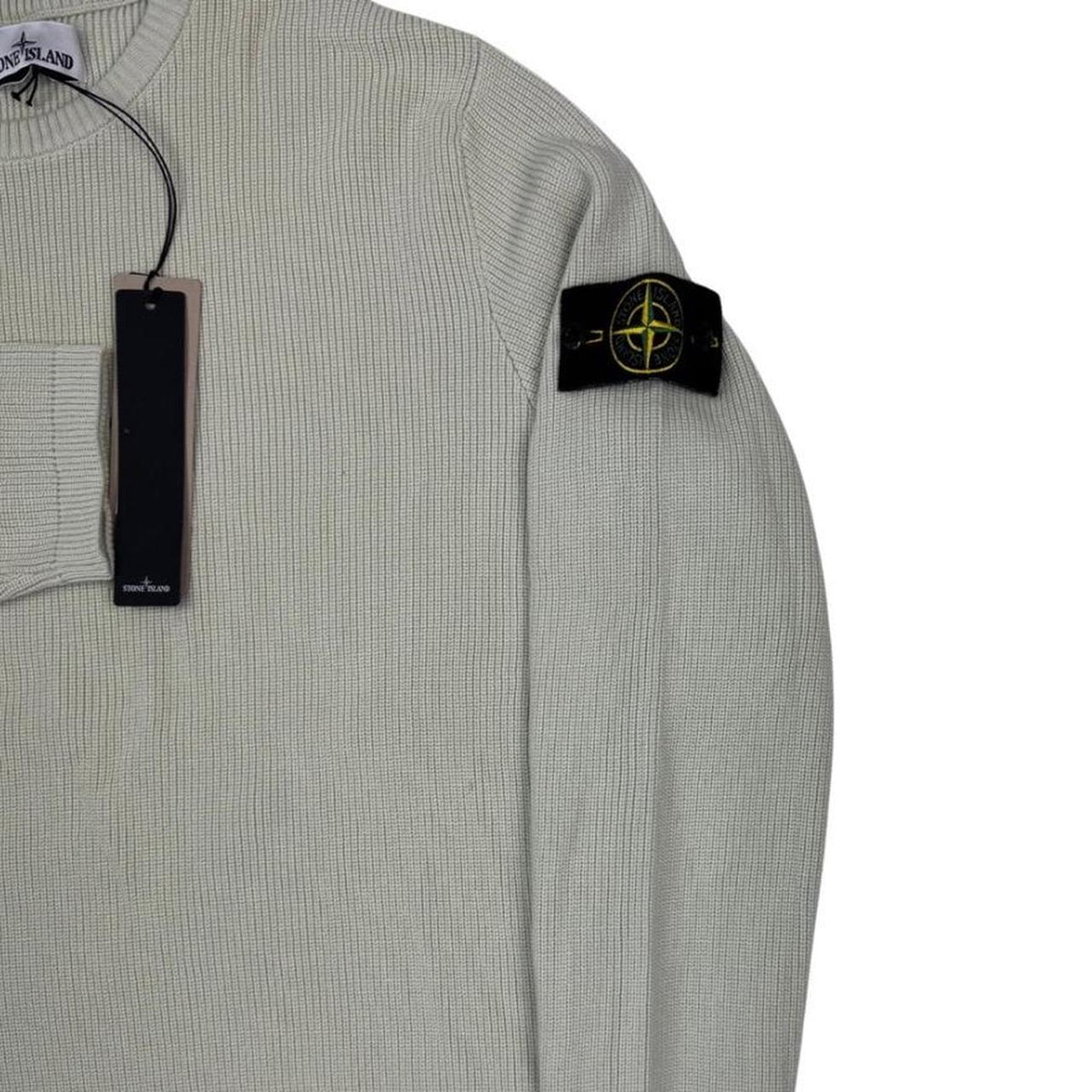 Stone Island beige waffle knit jumper with logo patch and organic cotton material.