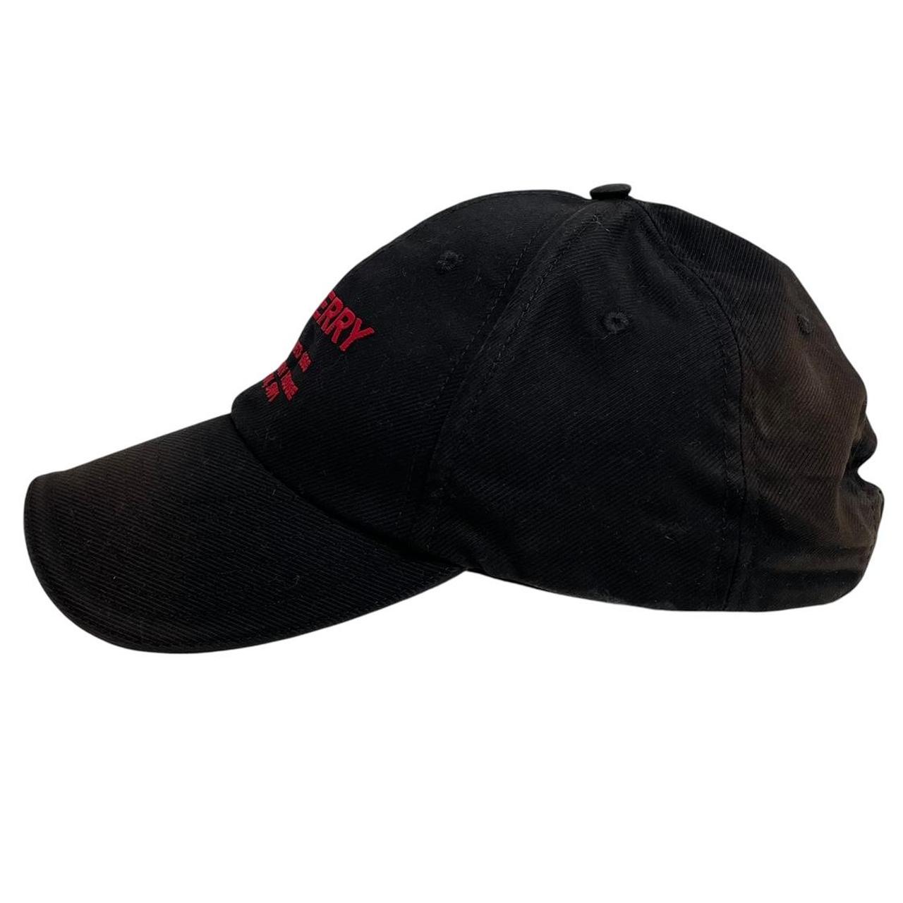 Burberry black baseball cap with red Horseferry logo embroidery and worn condition.