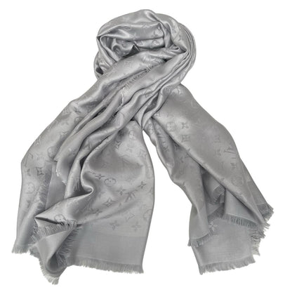 Louis Vuitton grey shawl scarf with LV monogram pattern in silk and wool blend.