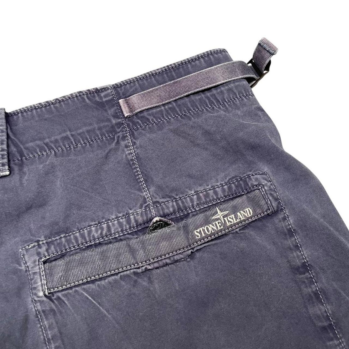 Stone Island navy blue Bermuda shorts with logo patch and cotton material.