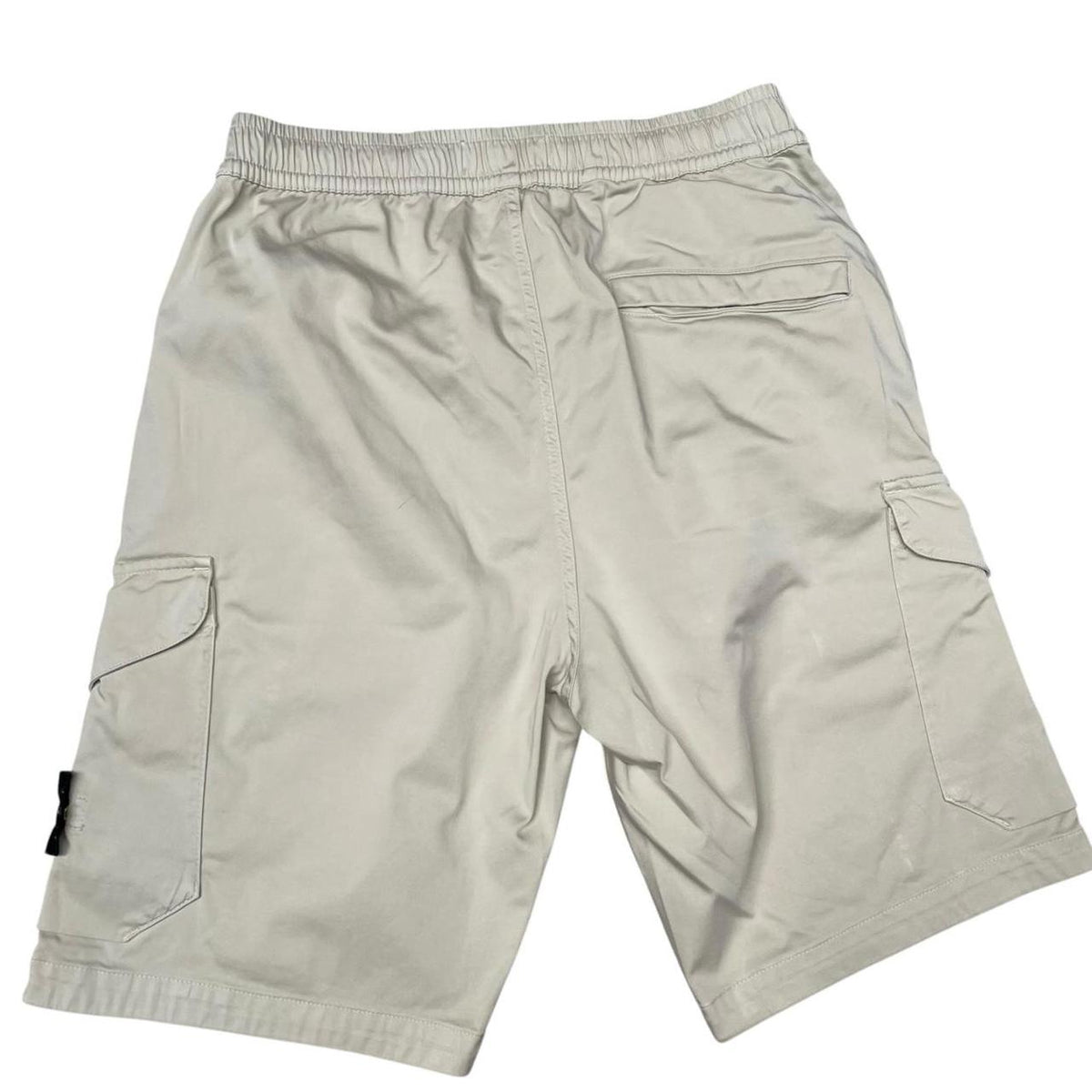 Stone Island beige cargo shorts with logo patch and multiple pockets.