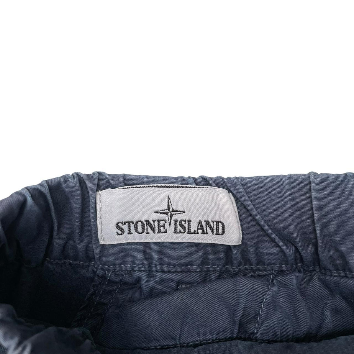 Stone Island navy blue cargo shorts with logo patch and cotton material.