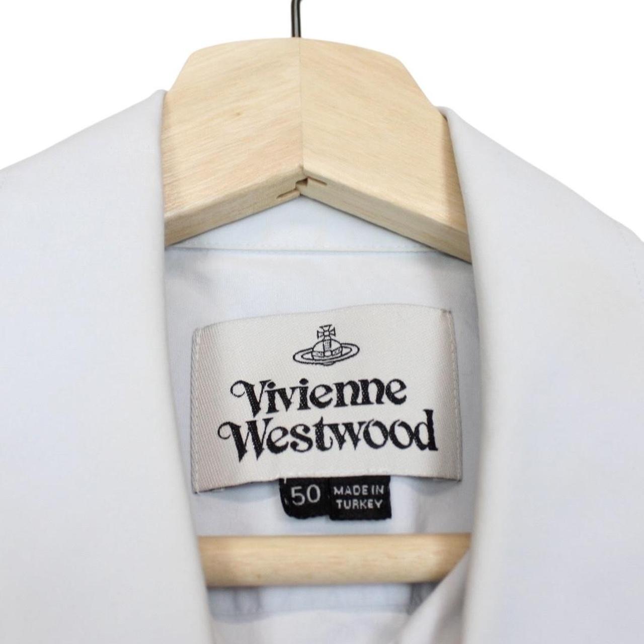 Vivienne Westwood light blue short sleeve cotton shirt with orb logo and collar discoloration.