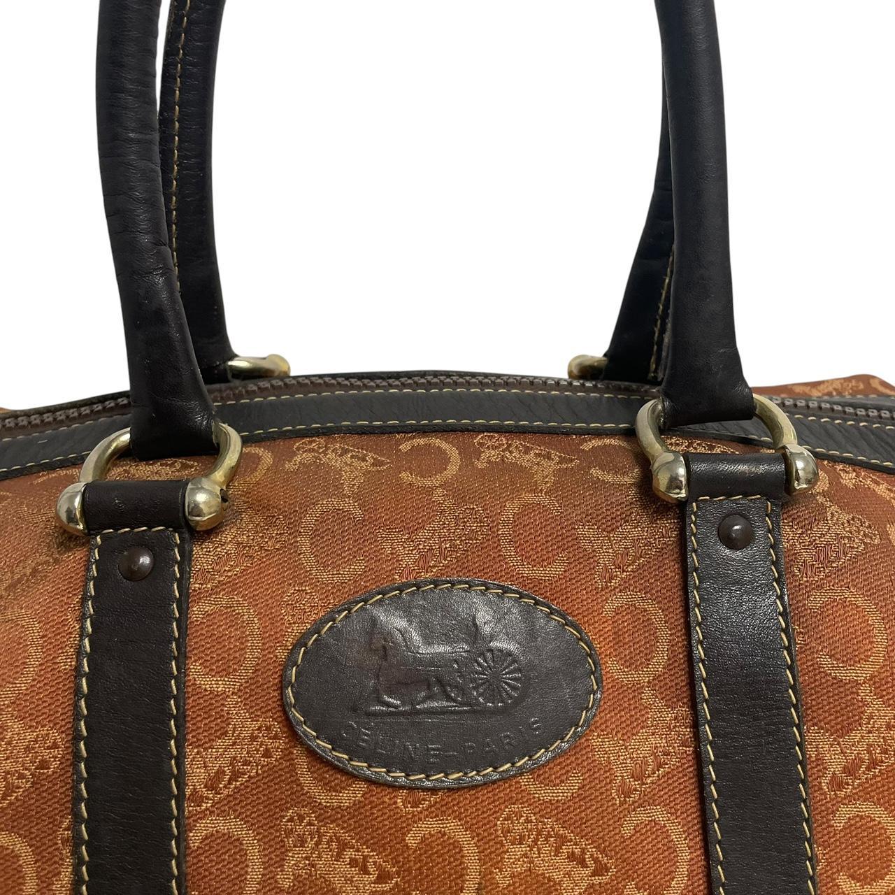 CELINE orange duffel bag with Macadam canvas and leather, visible wear and discolouration.