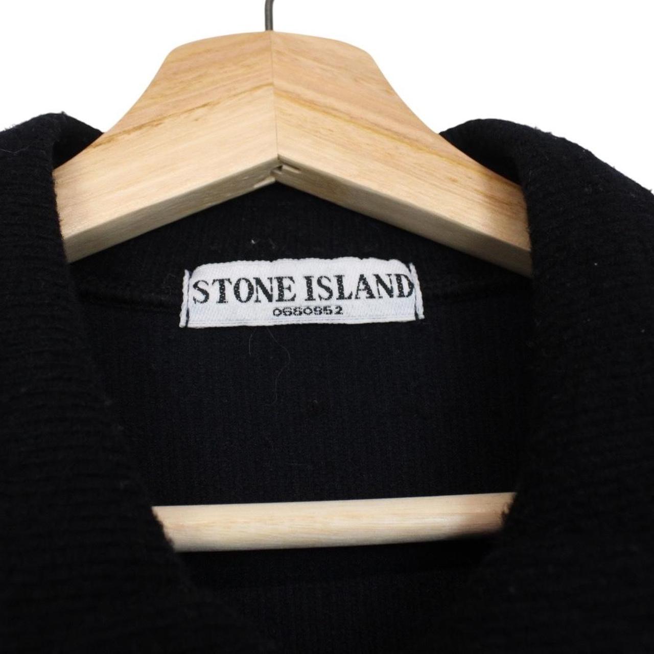 Stone Island black wool knit jumper with iconic compass logo and vintage design.