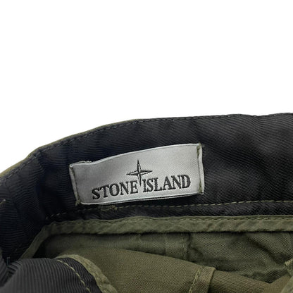 Stone Island khaki green skinny fit cargo trousers with logo patch and pockets.