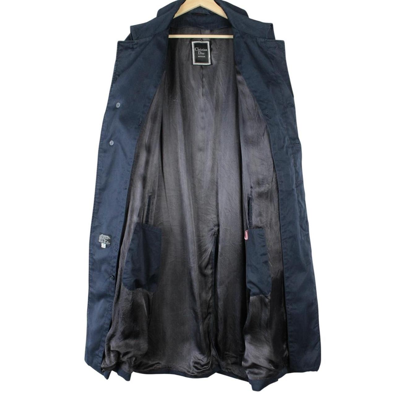 Christian Dior navy blue trench coat, single-breasted, vintage 90s style, classic design.