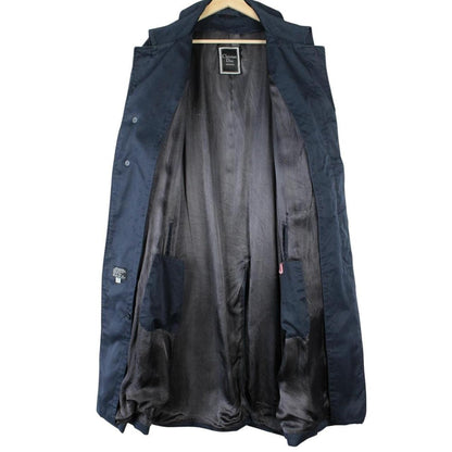 Christian Dior navy blue trench coat, single-breasted, vintage 90s style, classic design.