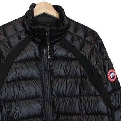 Canada Goose black down jacket with full zip and logo patch on sleeve.