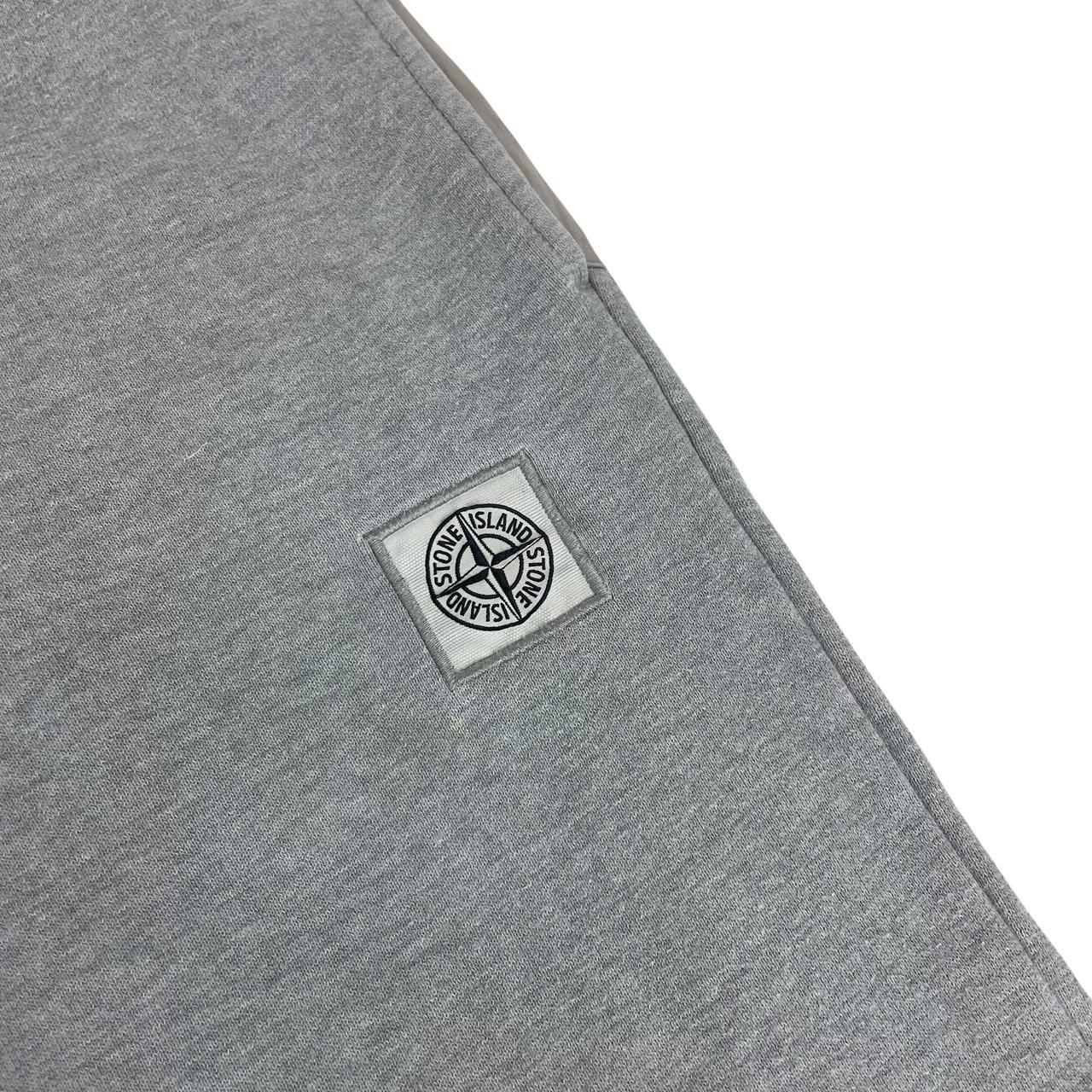 Stone Island grey tracksuit bottoms cotton material with logo patch and faint marks.